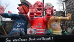 Nordrhein-Westfalen, Düsseldorf: Ein Mottowagen gegen die Attacken auf Einsatzkräfte wird zum Rosenmontagszug gefahren