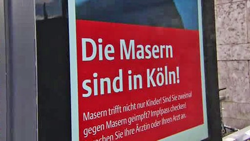 Schild: Die Masern sind in Köln