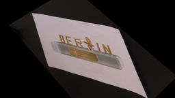 Schrift Berlin mit Kameramotiv