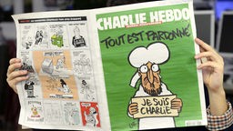 Mann liest in neuer Ausgabe von Charlie Hebdo