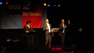WDR 2 Lachen Live mit Maria Grund-Scholer, Henning Bornemann und Renè Steinberg (v.l.)