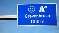Autobahnschild mit "Grevenbruch"