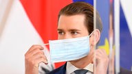 Österreichs Kanzler Sebastian Kurz mit einem Atemschutz
