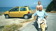 Tanja Schildknecht (Sybille Waury) und Dr. Ludwig Dressler (Ludwig Haas) in Griechenland am Strand