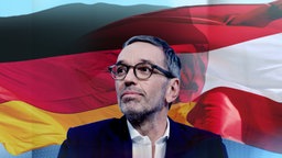 Bundesparteiobermann der FPÖ, Herbert Kickl, vor einer deutschen und einer österreichischen Flagge