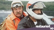 Thanner (Eberhard Feik, l) soll endlich mal Landluft atmen. Mit diesem Versprechen lockt Schimanski (Götz George, r) seinen Freund und Kollegen an den Tatort.