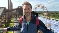 Moderator Daniel Aßmann vor der Kokerei Zollverein