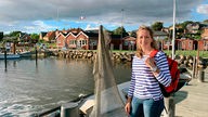 Tamina Kallert besucht Lolland in Dänemark. Die typisch roten Holzhäuser findet sie im idyllischen Hafenstädtchen Nysted. 