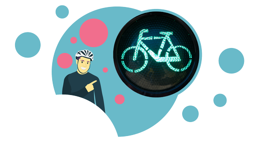 Ein gezeichneter Fahradfahrer zeigt auf eine grüne Fahrrad-Ampel