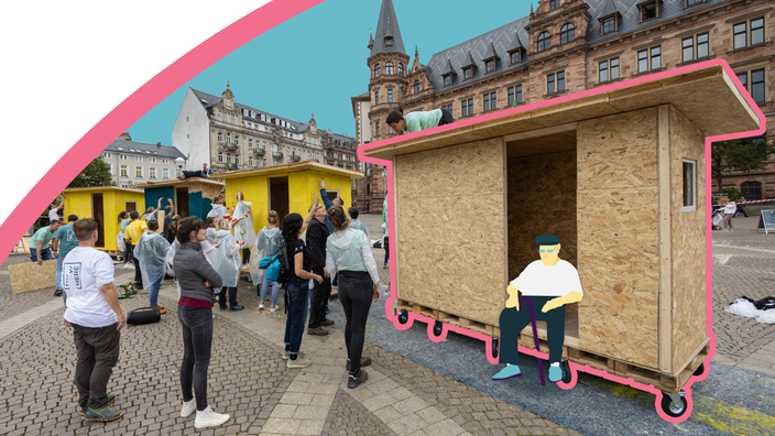 Freiwillige vom Verein Little Home aus Köln, die Tiny Häuser für Wohnungslose in Wiesbaden bauen.