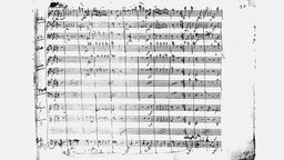 Eine Notenhandschrift von Wolfgang Amadeus Mozart aus der Sinfonie in g-Moll KV 550