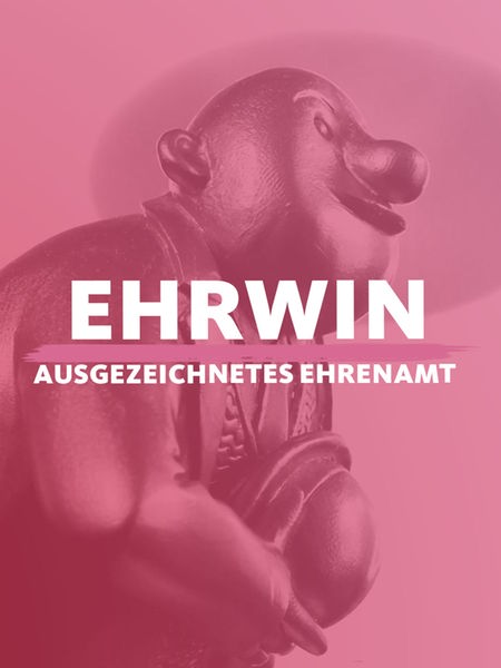 Die goldene Ehrwin-Statue, davor der Titel "Ehrwin - ausgezeichnetes Ehrenamt"