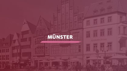 Der Blick auf die Altstadt in Münster. Darauf der Schriftzug "Münster".