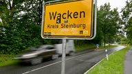 Das Ortsschild von Wacken, Kreis Steinburg
