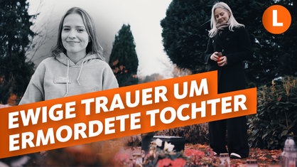 Mutter Tanja K. steht auf dem Friedhof mit einem Grablicht in der Hand