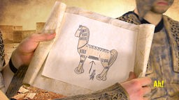 Eine männliche Person hält eine Zeichnung eines gemalten Pferdes hoch