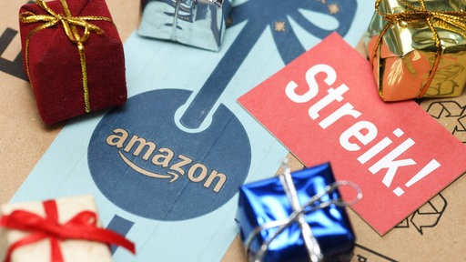 Streik Schild und Geschenke auf Amazon Paket 