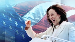 Kamala Harris jubelnd vor einer amerikanischen Flagge