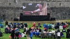 People watch Britain's King Charles and Queen Camilla coronation ceremony at Pembroke Castle, Wales