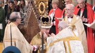 King Charles III receives The St Edward's Crown during his coronation ceremony in Westminster Abbey