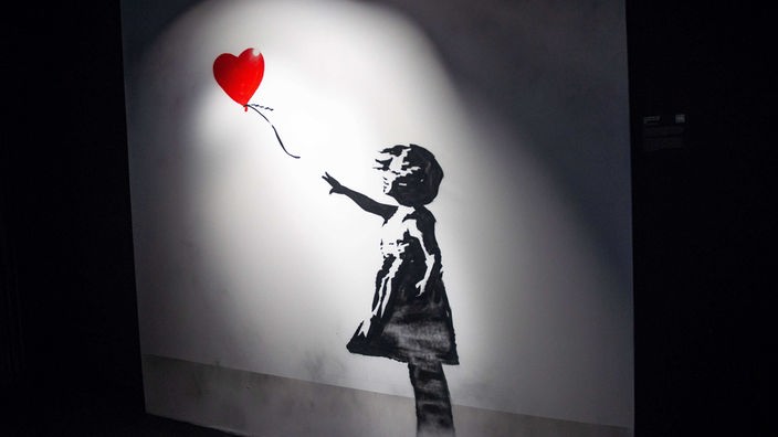Kunstwerk von Banksy, Streetart-Künstler, Mädchen mit Ballon