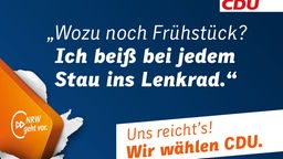 CDU Wahlplakat im Landtagswahlkampf 2017 mit Aufschrift: "Wozu noch Frühstück? Ich beiß bei jedem Stau ins Lenkrad."