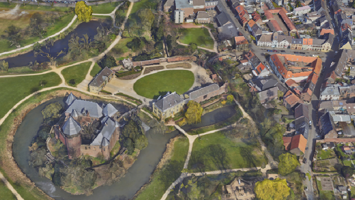 Auf dem Bild sieht man Krefeld in 3D von oben. Abgebodlet ist die Burg Linn sowie Häuser und Straßen.
