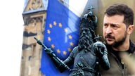 Eine Statue von Karl der Große mit einer Fahne der Europäischen Union vor dem Rathaus in Aachen.