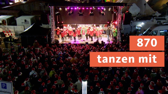Beim Weihnachtstanz in Castrop-Rauxel tanzen 870 Menschen mit der WDR Lokalzeit und stellen Weltrekord auf