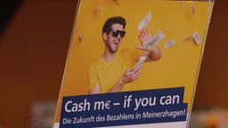 Werbeplakat zur bargeldlosen Zahlung in Meinerzhagen