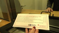 Brief der Sparkasse Halle Westfalen mit Fragebogen zum Schutz vor Betrugsmaschen