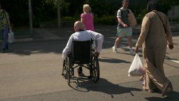 Person im Rollstuhl