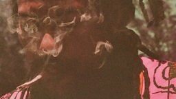 Cover des Albums "Zero Grace" von Liam Bailey: Nahaufnahme eines Mannes mit Zigarette im Mund, deren Rauchschwaden das Gesicht leicht verdecken