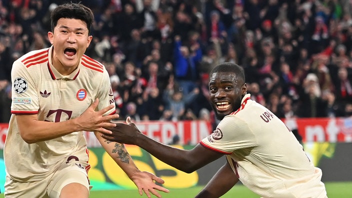 Spielszene: Bayern Minjae KIM (links) jubelt mit Dayot Upamecano in der Champions League (Nahaufnahme)