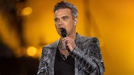 Robbie Williams auf der Bühne bei einem Konzert in München (26.08.2022)