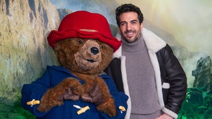 Elyas M'Barek und Paddington bei der Deutschlandpremiere von "Paddington in Peru" im Berliner Zoo-Palast (18.01.2025)