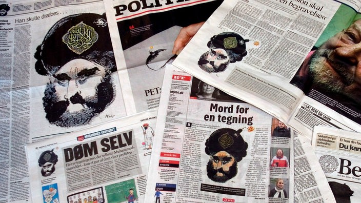 Dänische Zeitungen auf denen eine Karikatur von Mohammed abgebildet ist.