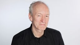Moderator Michael Struck-Schloen