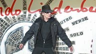 Udo Lindenberg poses during the unveiling of the 'Friedenswand', a picture created by four artists and singer Udo Lindenberg
