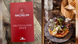 Das Buch Guide Michelin Restaurants 2023 neben einem Haute-Cuisine-Gericht