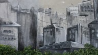 Ein Graffiti von mehreren grauen Häusern.