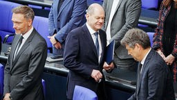 Christian Lindner (FDP), Olaf Scholz (SPD) und Robert Habeck (Grüne) im Bundestag (2023).
