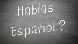 Auf einer Tafel steht "Hablas espagnol?"