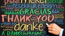 Das Wort "Danke" steht in vielen verschiedenen Sprachen auf schwarzem Hintergrund.