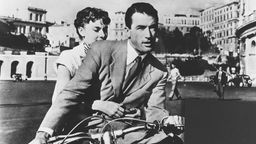 Gregory Peck und Audrey Hepburn in einer Szene aus dem Film "Ein Herz und eine Krone"