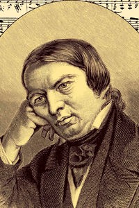 Noten-Handschrift und Portrait von Robert Schumann
