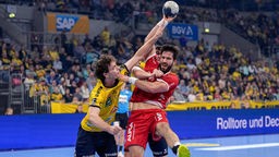 Handballprofi Tim Suton (r.) im Bundesliga-Spiel des TBV Lemgo bei den Rhein-Neckar Löwen