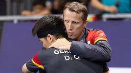 Tischtennis-Bundestrainer Jörg Roßkopf mit Dang Qiu.