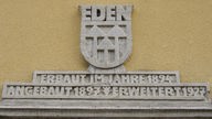 Oranienburg-Eden: Inschrift am Genossenschaftshaus 