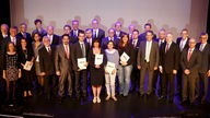 Die Preisträger, Jurymitglieder, die Vorstände des Rheinisch-Westfälischen Genossenschaftsverbandes (RWGV) und die Vertreter der genossenschaftlichen Banken.